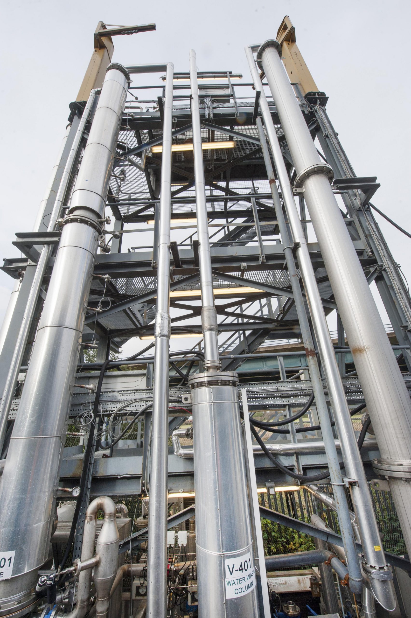 a picture of the tall, metallic pipes of the amine capture plant